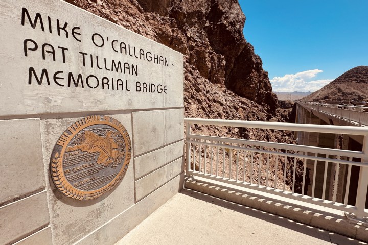 a sign on the side of a fence