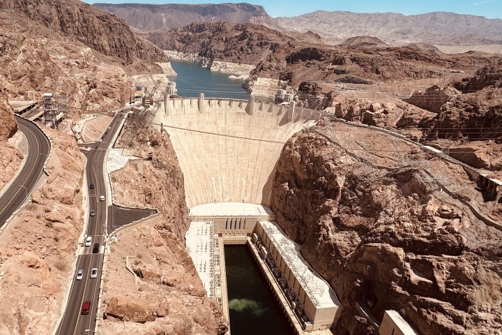 a view of a rocky mountain with Hoover Dam in the background
