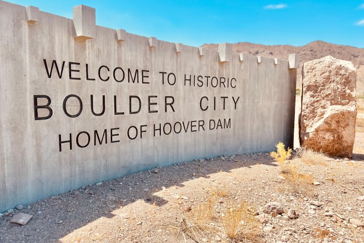 a sign on a brick wall