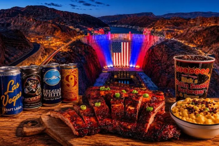 Ribs and beer cans in front of illuminated dam with American flag.